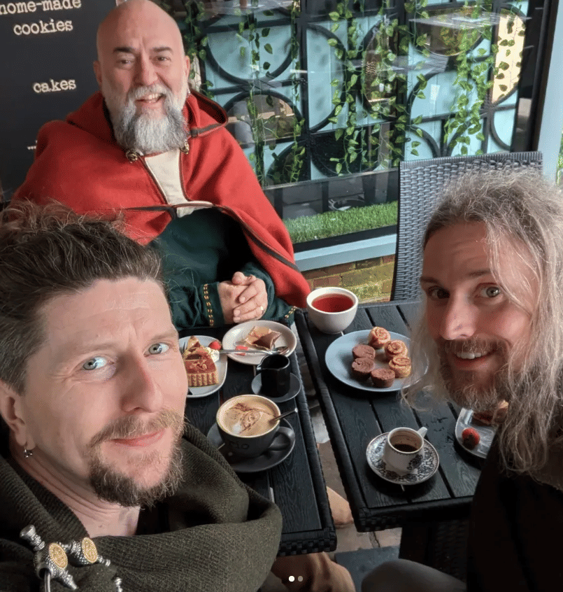 Three viking men enjoying one of York's excellent patisseries.