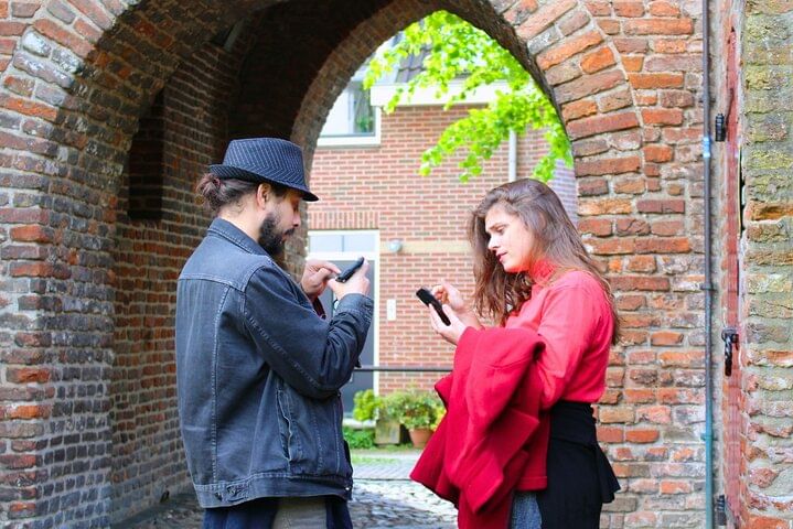 Players solve a riddle in city game Amsterdam