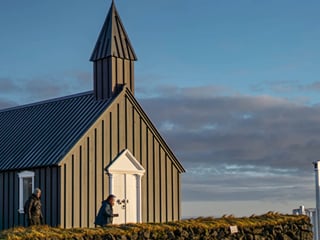 Travelers exploring natural scenery in Iceland