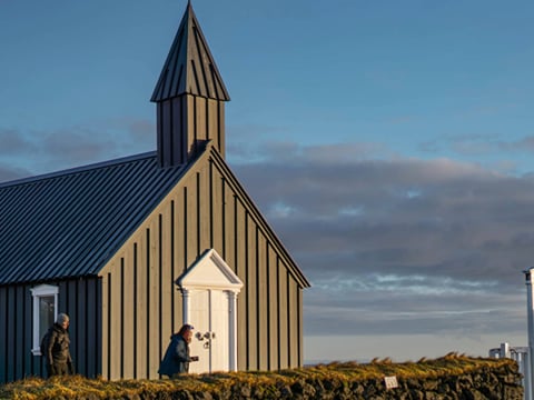 Travelers exploring natural scenery in Iceland