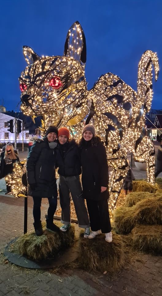 Travellers posing for a picture in front of the Icelandic Christmas Cat