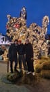 Travellers posing for a picture in front of the Icelandic Christmas Cat 