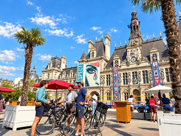 The group stopped with their bikes outside the Hôtel de Ville