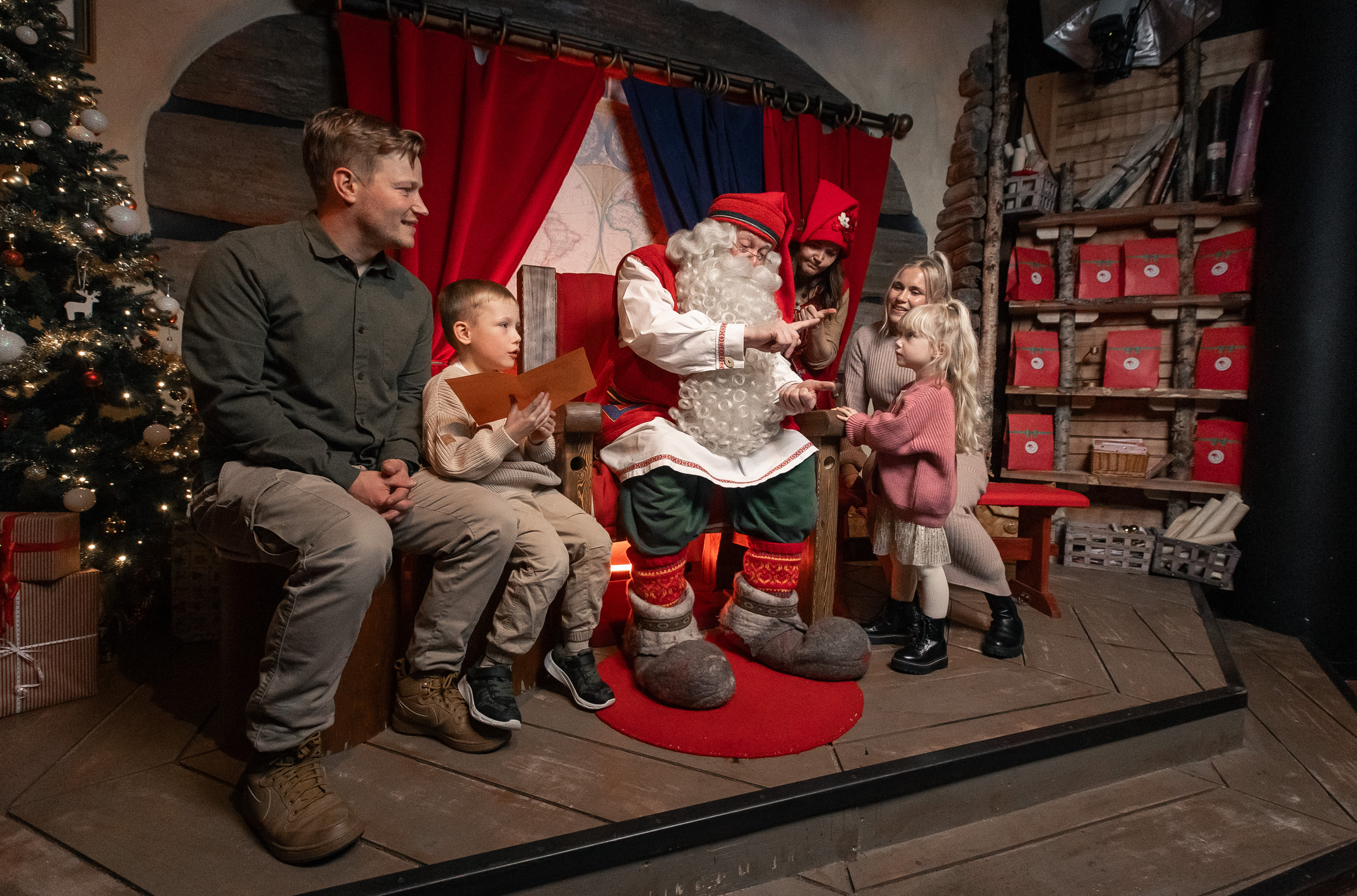 Family with Santa Claus in Santa Claus Office Christmas Express Pass