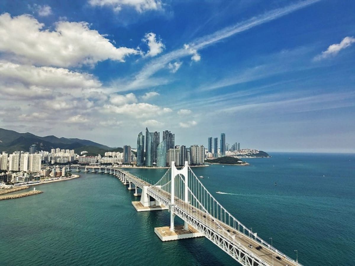 A clear-day view of Busan’s Diamond Bridge along the coastline.
