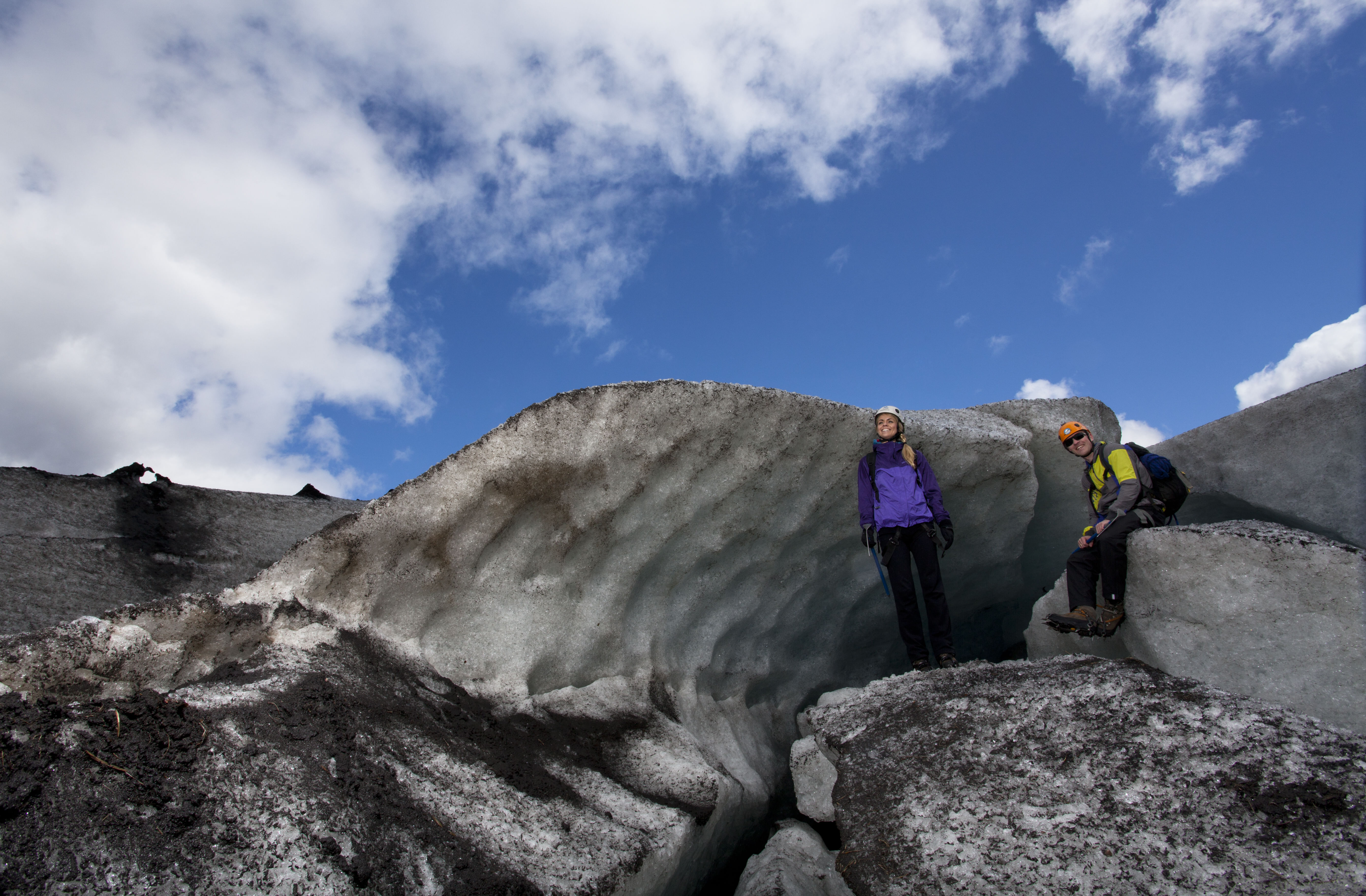 Couple of Hikers posing next to the Glacier