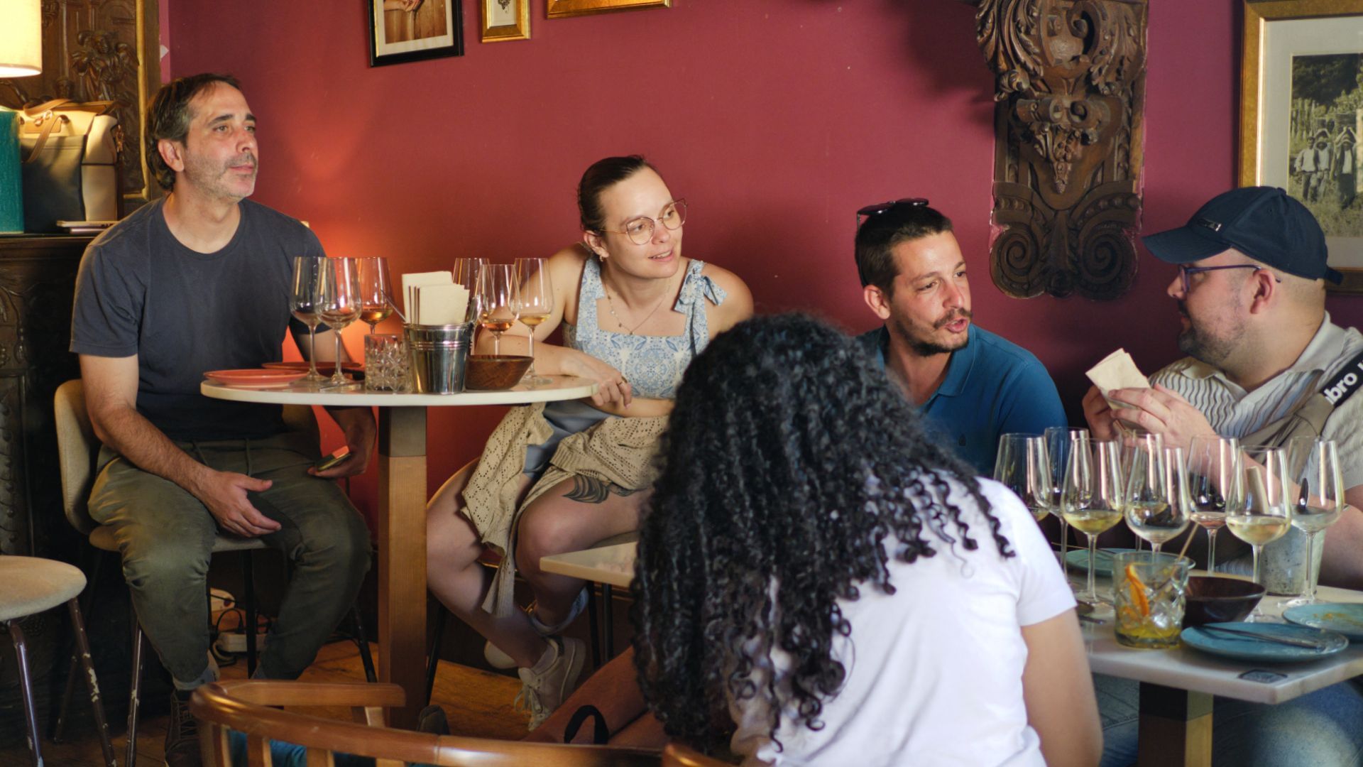 Guests participating in a guided wine tasting inside a Porto wine bar
