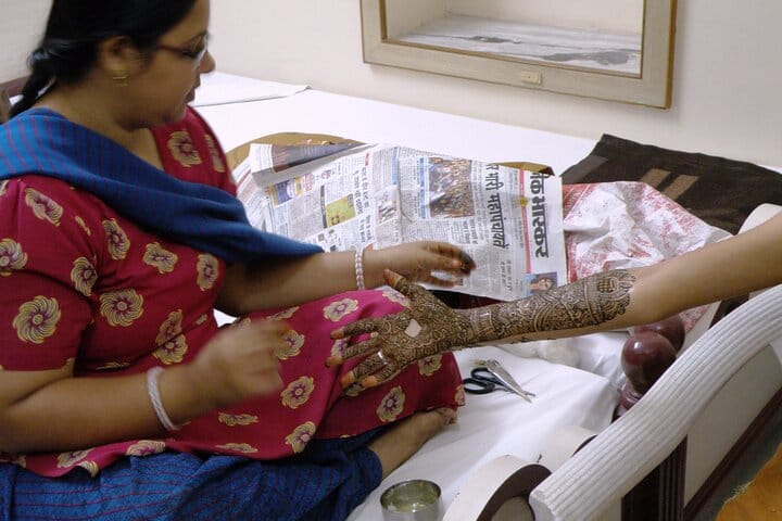 Applying Heena in hands