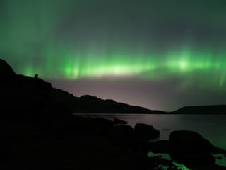 Northern Lights in a distance during Northern lights hunt tour