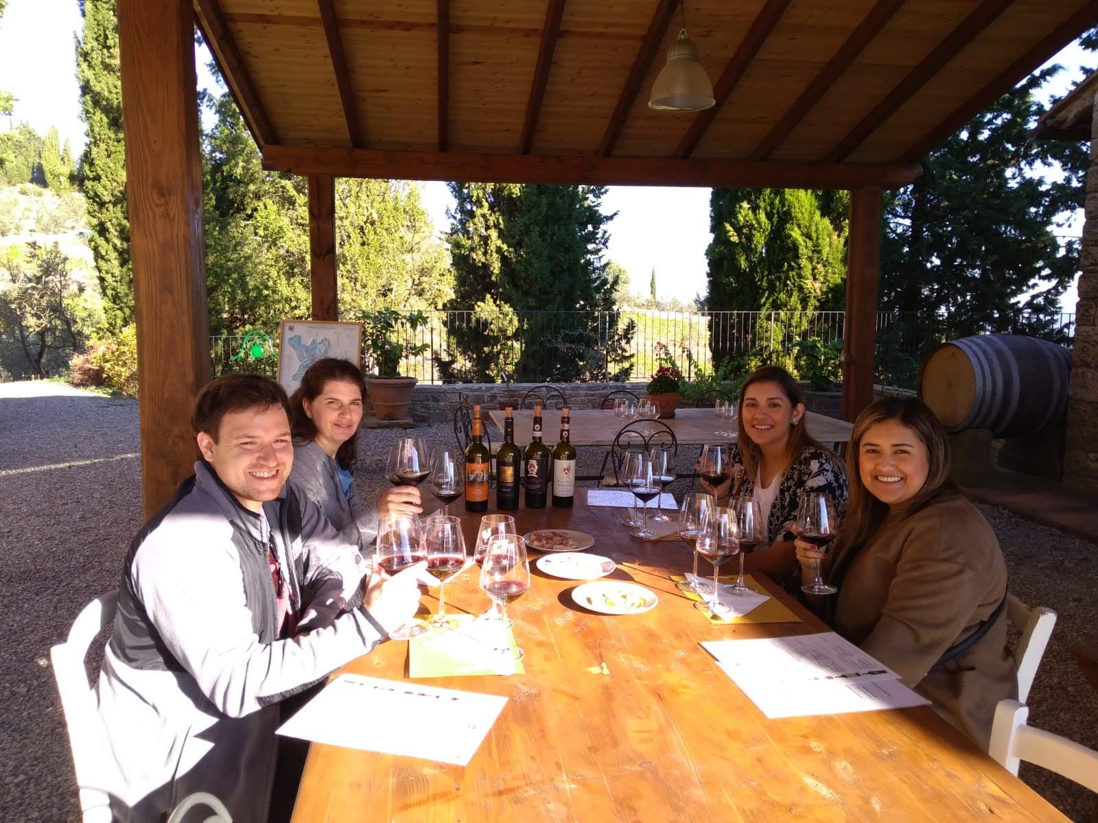 Customers enjoying a wine tasting of typical Tuscan wines