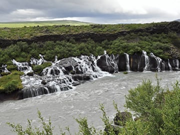 Hraunfossar on a moody West Iceland afternoon — the kind of landscape the tour buses don't reach.