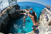Get ready for an adrenaline rush as we sail to the famous Negril cliffs, where you can brave the jump or simply watch the pro divers while the party heats up!