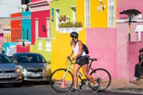 Pedal through Bo-Kaap's vividly colored streets and rich cultural atmosphere.