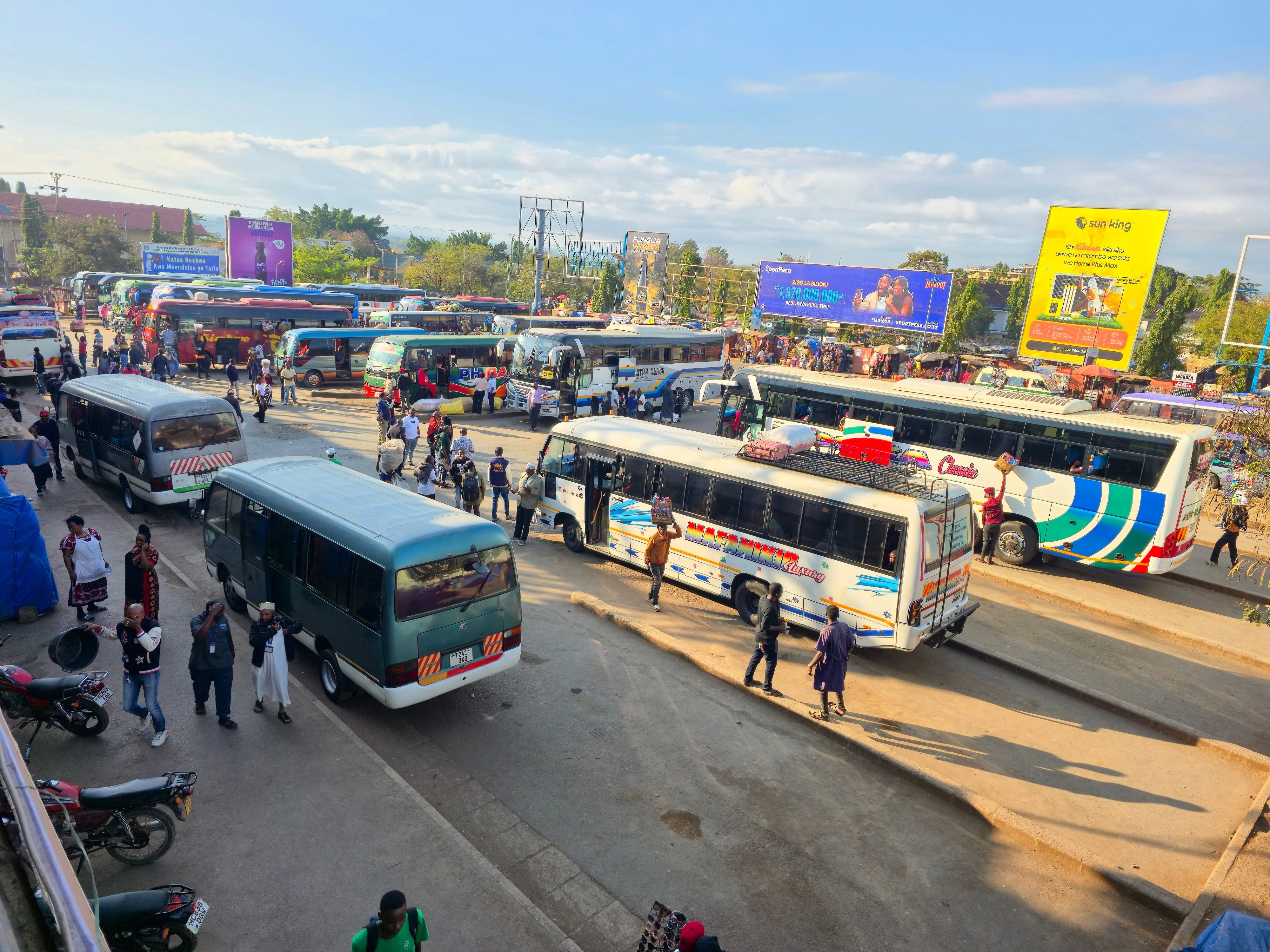 Bustling central bus stand and local transit in Moshi