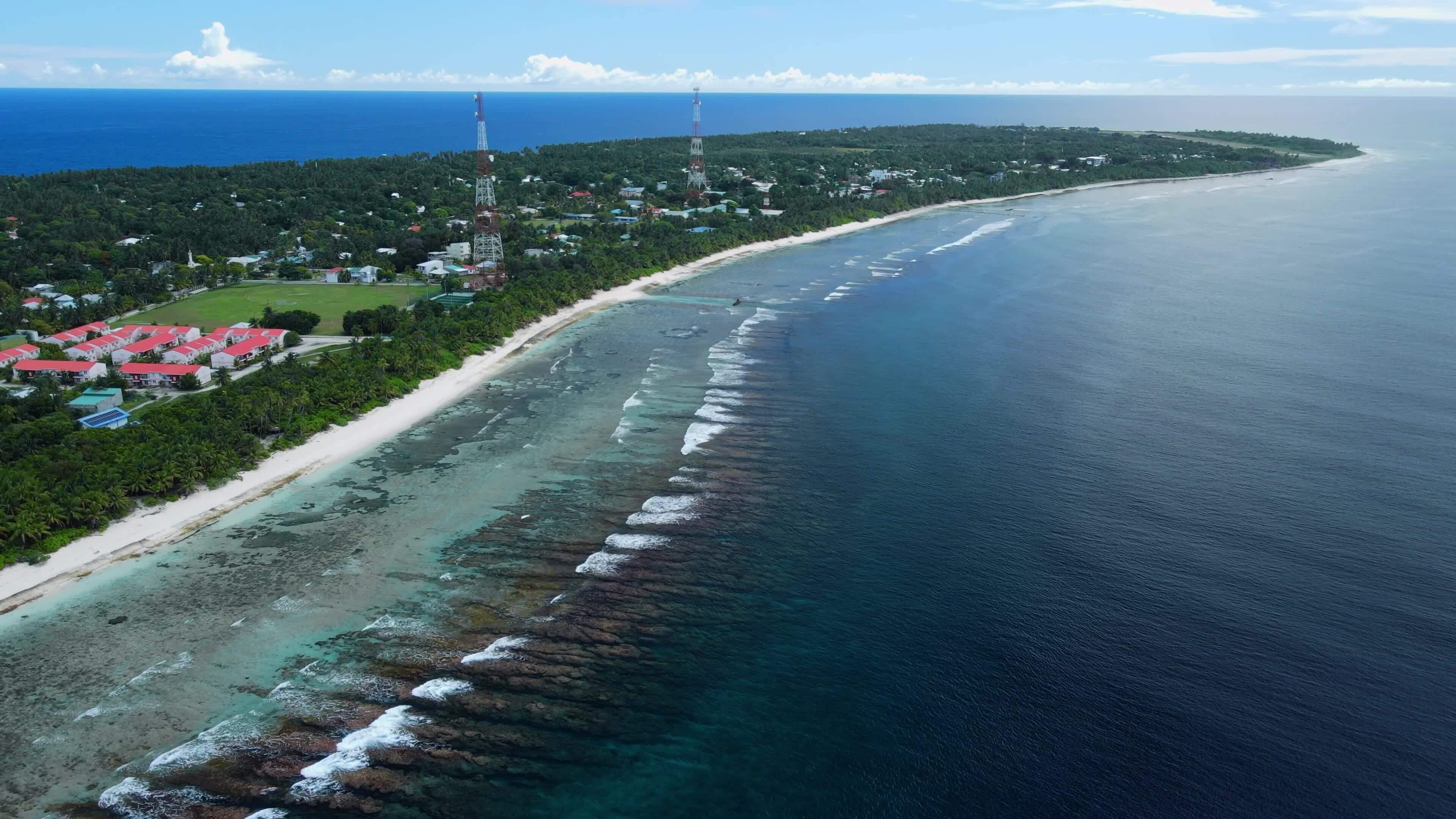 Aerial view of Fuvahmulah Island, highlighting Maynerey Beach with its pristine white sands and clear turquoise waters