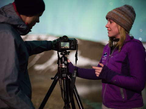 Photographing the sky during Northern lights super jeep tour from reykjavik