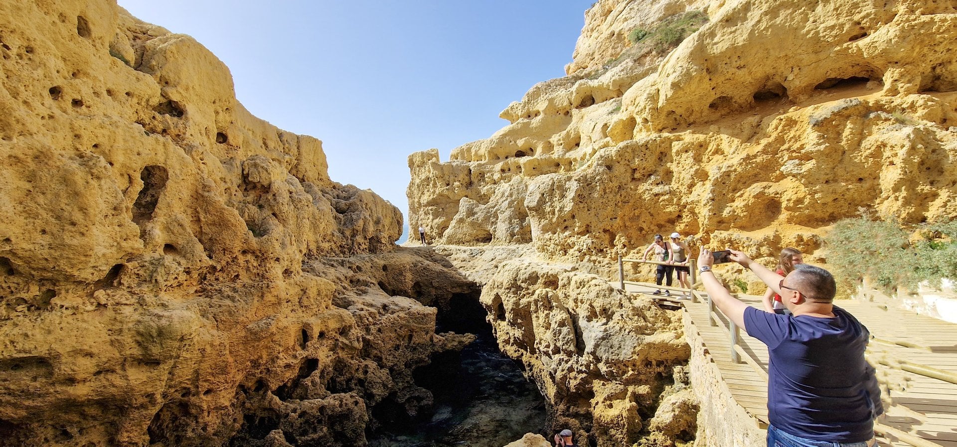 Cliffs and a viewing path along the Seven Hanging Valleys trail in the Algarve
