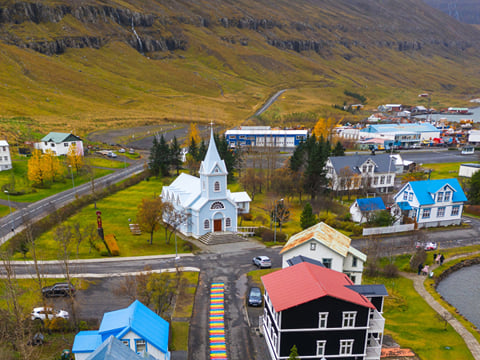 A rainbow path leads through the artistic heart of Seyðisfjörður.
