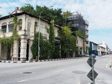 Charming heritage shophouses draped in greenery line the quiet streets of Old Town Ipoh, offering a glimpse into the city's colonial past and vibrant cultural soul.