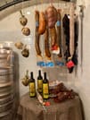 Sausages are hanging on the wall in a kitchen