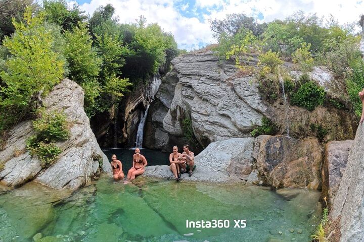 Admiring the cascading water and scenery .
