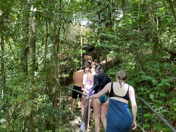 Swim beneath a tropical Belize waterfall