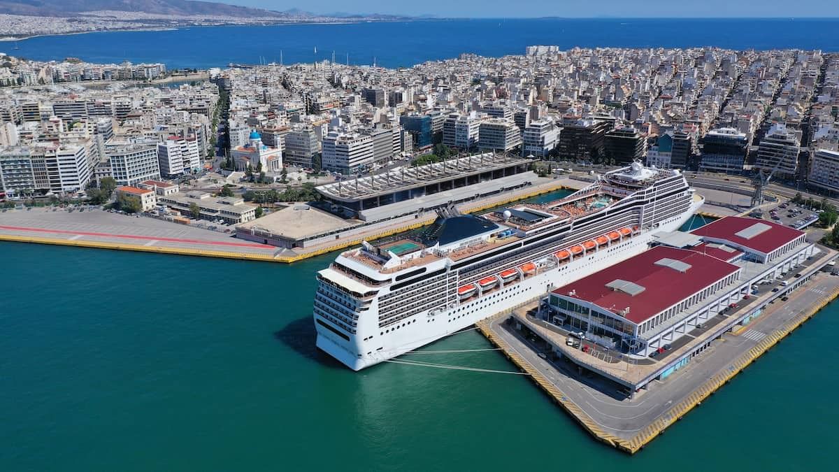 A view of the Piraeus Port with a cruise ship docked, ready for passengers to board.