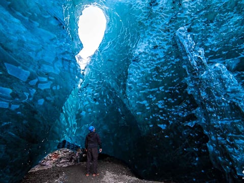 A man exploring at Jokulsarlon ice cave tour