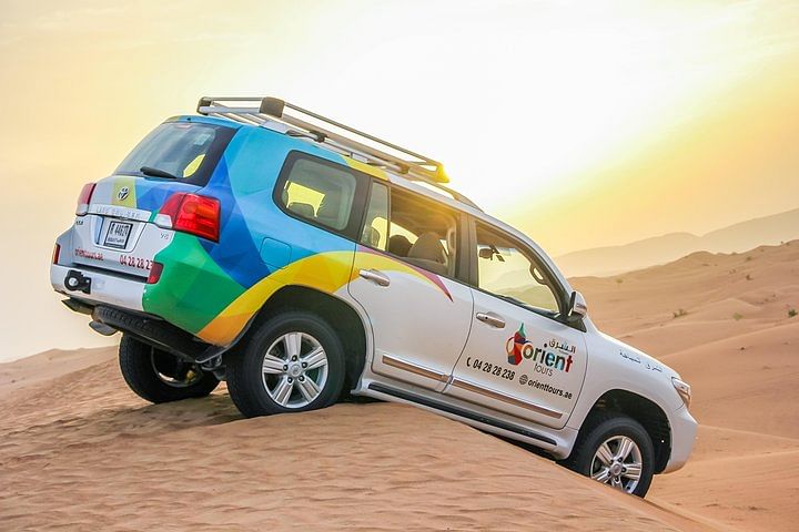 Dubai City Tour & Premium Desert Safari: Falcon Show, Sandboarding & BBQ