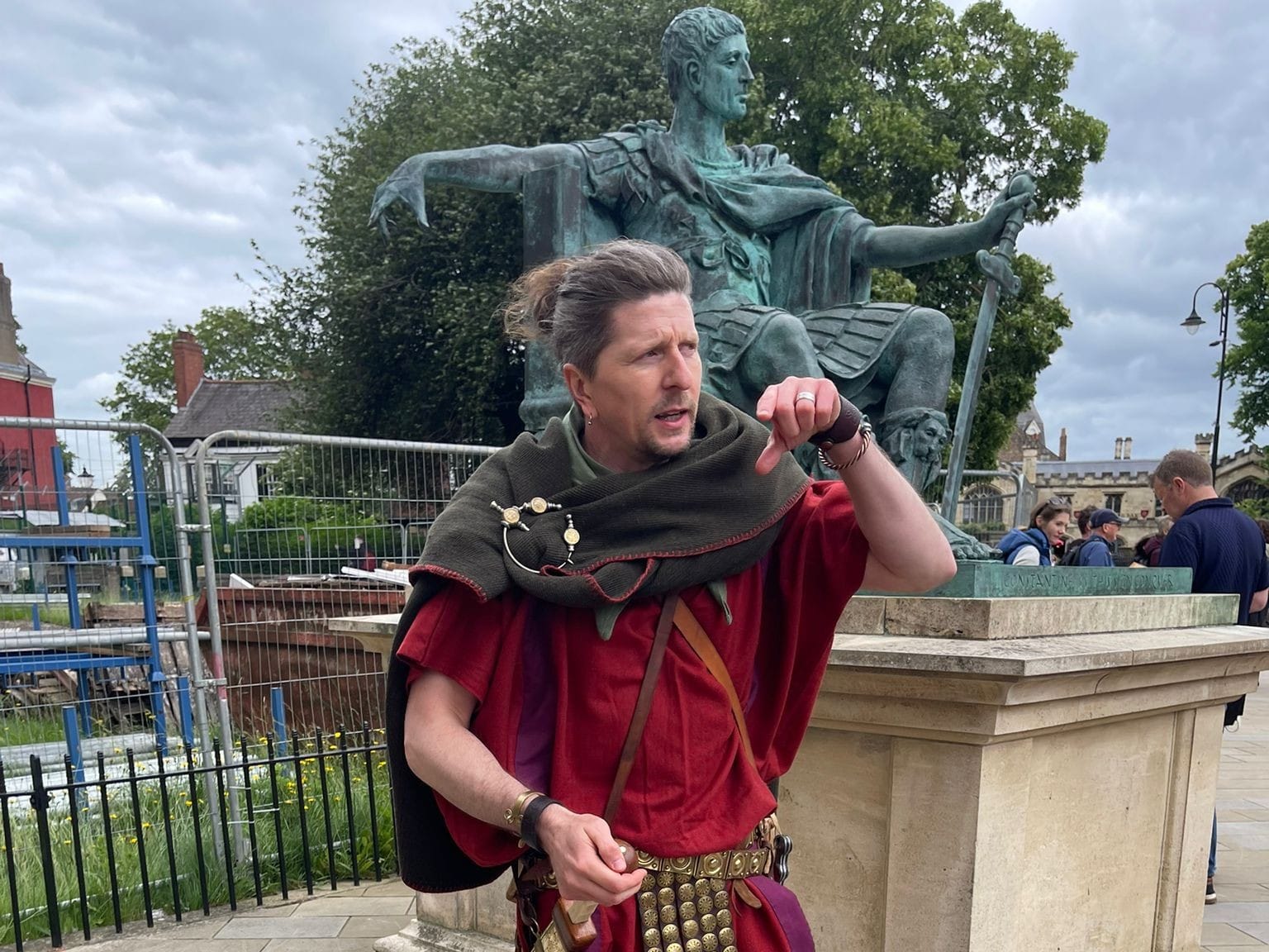 A Roman legionary stands besides the statue of Constantine the Great, besides York Minster.