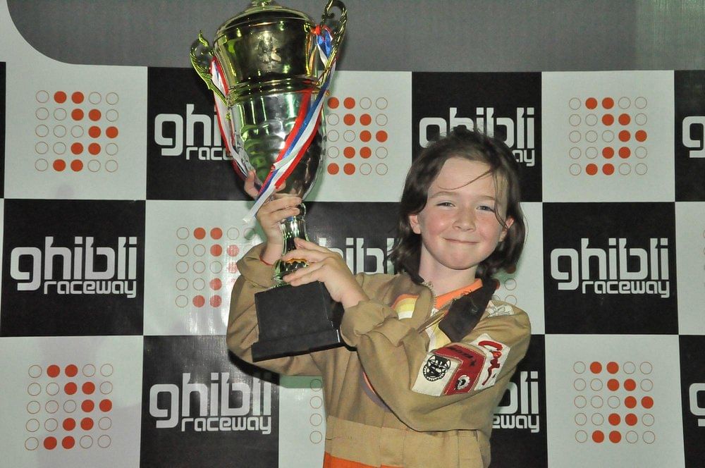Participants receiving safety gear and a briefing before their go-karting session at Ghibli Raceway.
