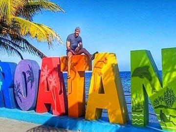 Stop at the Roatan Sign