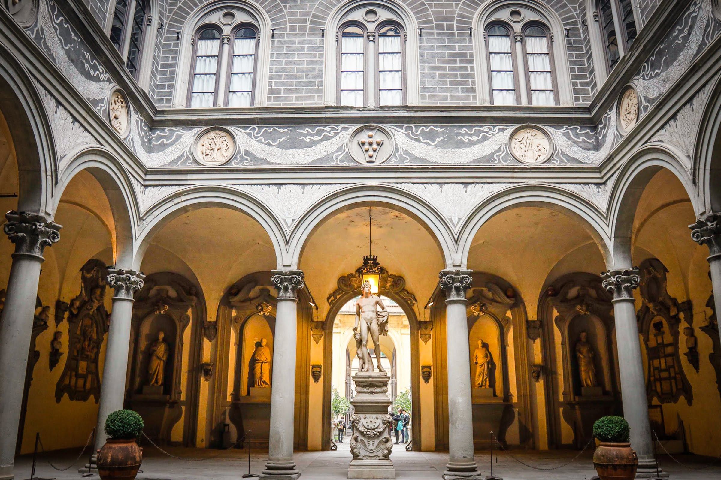 View of the internal courtyard of Palazzo Medici Riccardi with its vaulted loggia and sculptures 