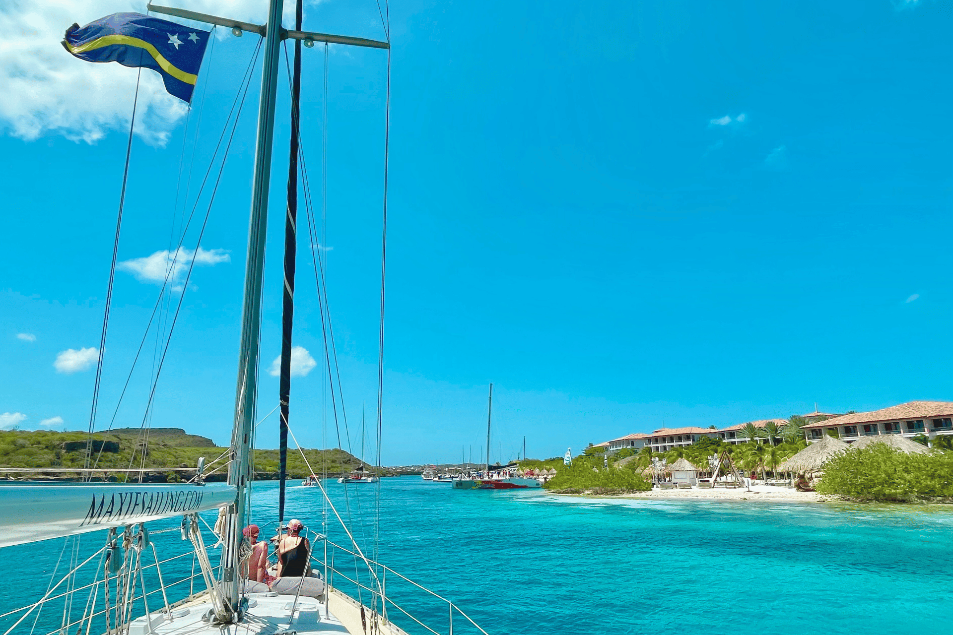 Romantic couple enjoying private sunset cruise in Curacao with Maxie Sailing