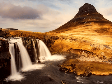 Kirkjufell, with its symmetrical peak and nearby cascading falls, is a picture-perfect scene straight from a fairytale