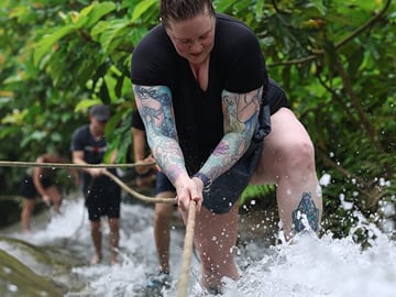 Our tour guide will hike with you inside the waterfalls.