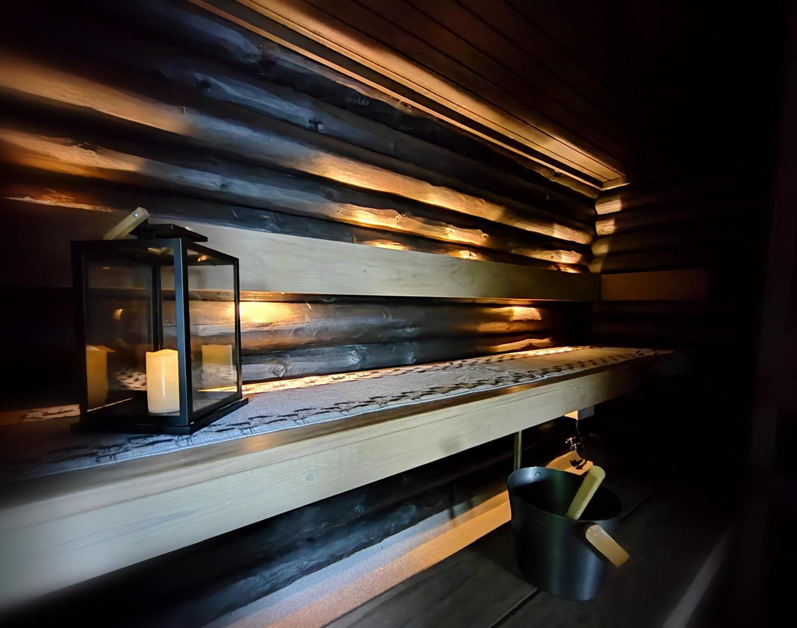 Traditional wooden sauna in candle light.