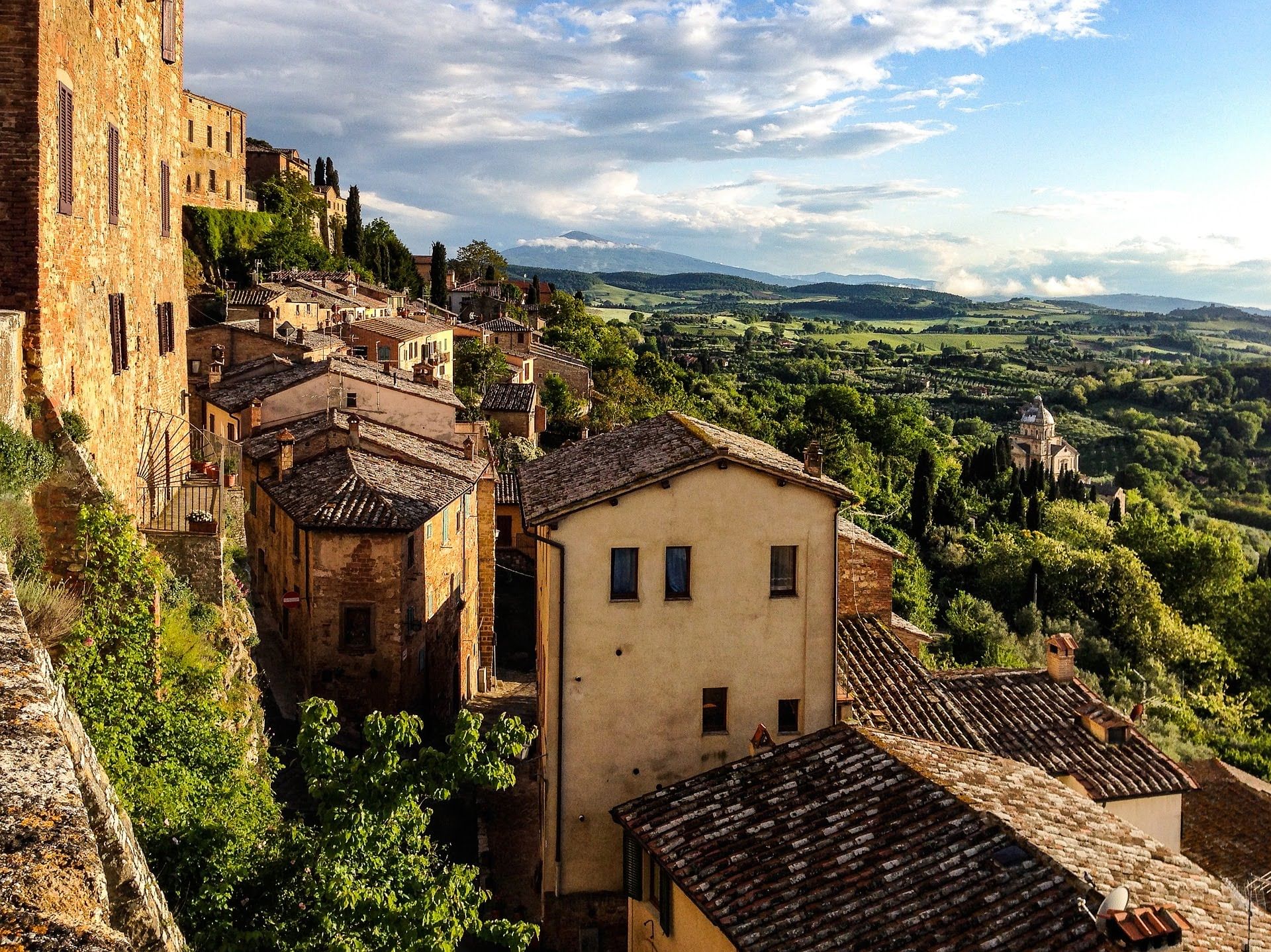 Close-up of some buildings in Montepulciano with the countryside on the background