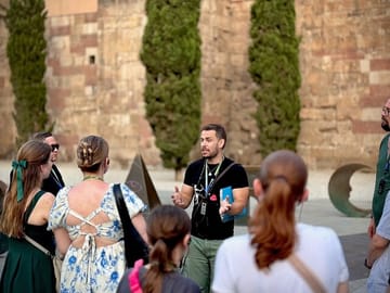 Tour Guide explaining the history of the Spanish Civil War in Barcelona to a group of guests