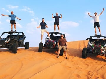 Short Desert Tour with Quad Bike Camel Ride Sandboard & Sunset