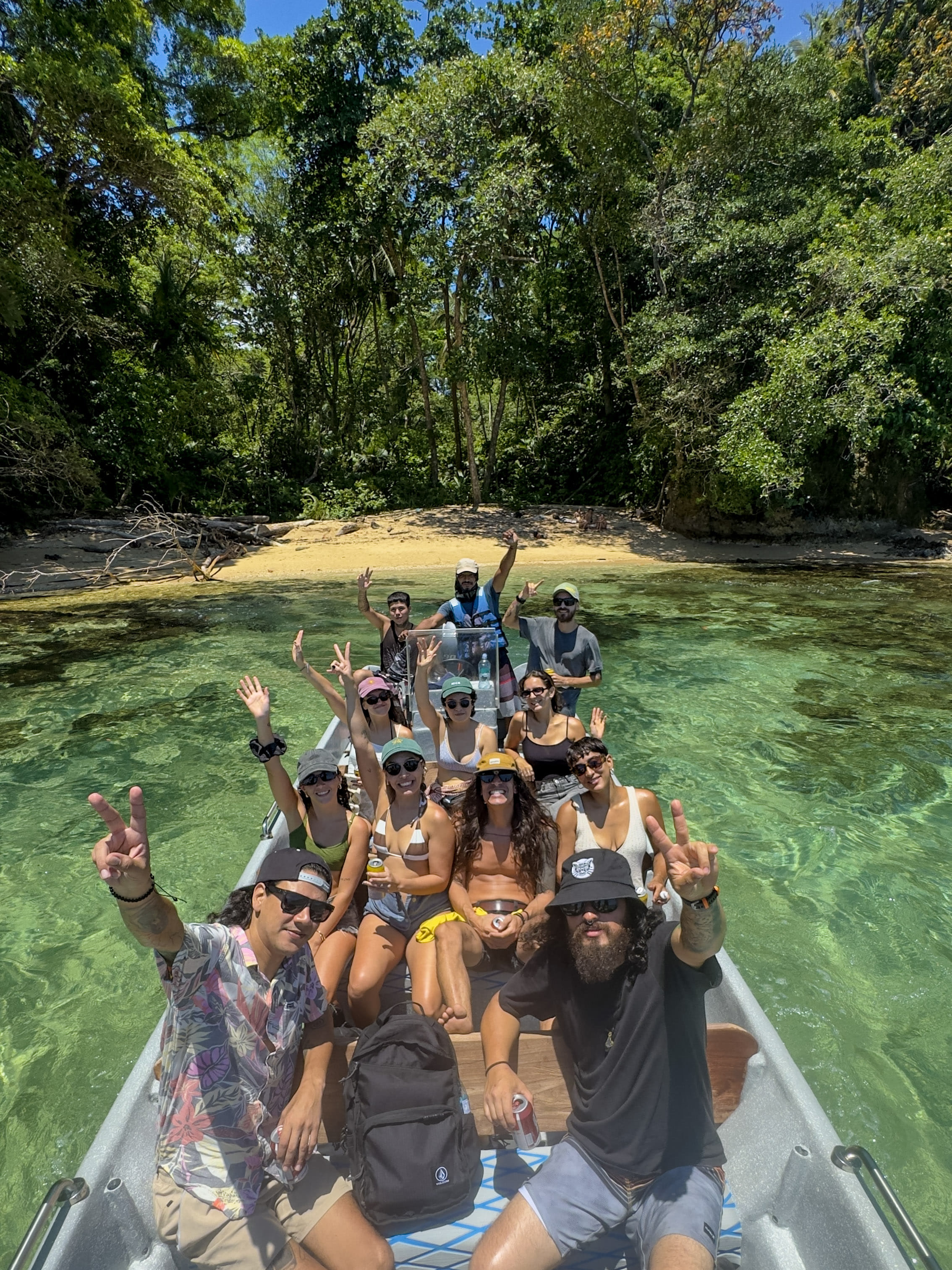 Guests exploring Punta Mona's turquoise waters during a dolphin watching and beach hopping boat tour from Manzanillo, Costa Rica.