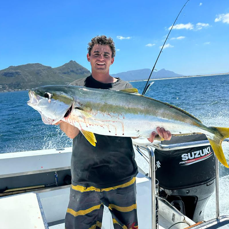 Experience the thrill of reeling in prized fish beneath vibrant blue skies.