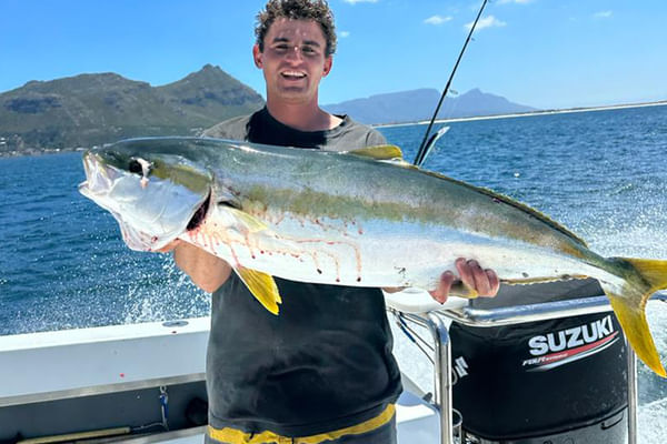 Experience the thrill of reeling in prized fish beneath vibrant blue skies.