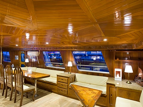 Inside of a luxurious yacht with seating area and comfortable lodgings