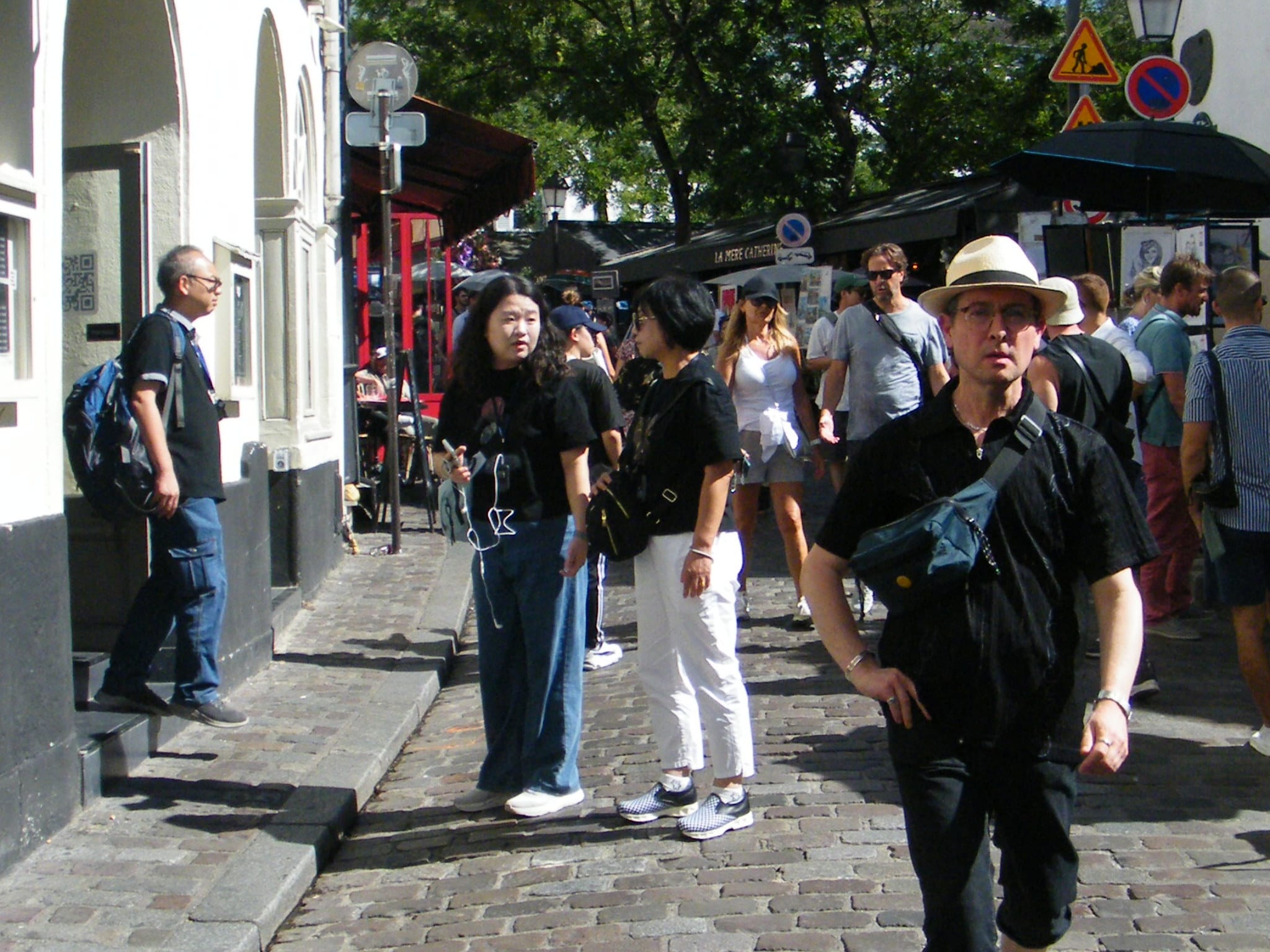 Tourist in Place Dutertre at Montmartre during a walking tour with Voilà Tours
