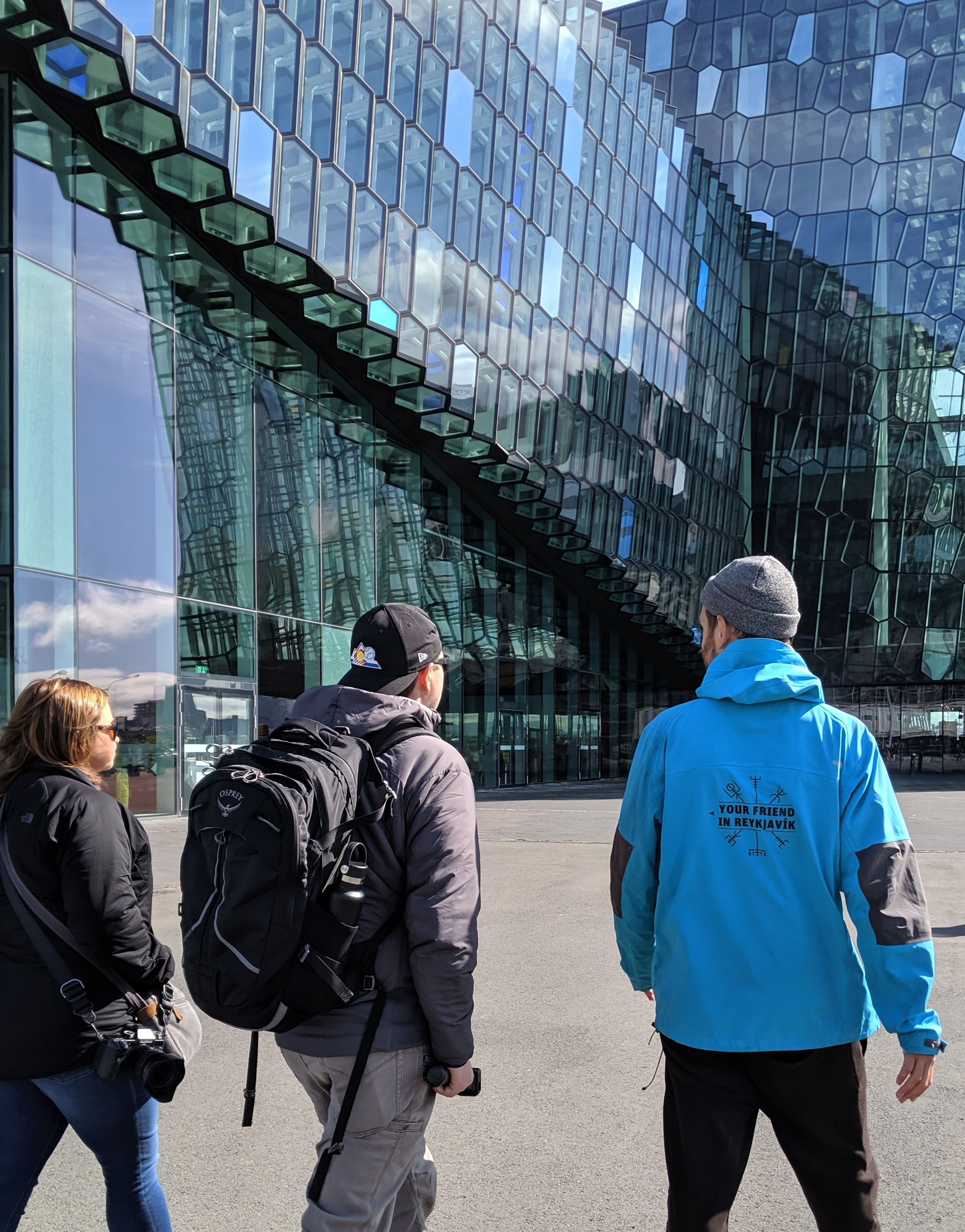 A guide from Your Friend in Reykjavik showing the Harpa Concert Hall to guests