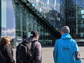 A guide from Your Friend in Reykjavik showing the Harpa Concert Hall to guests