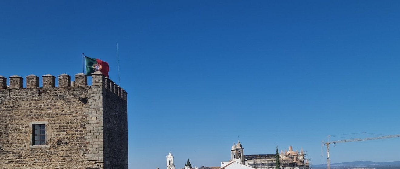 The castle tower of Monsaraz with the Alentejo plain behind it