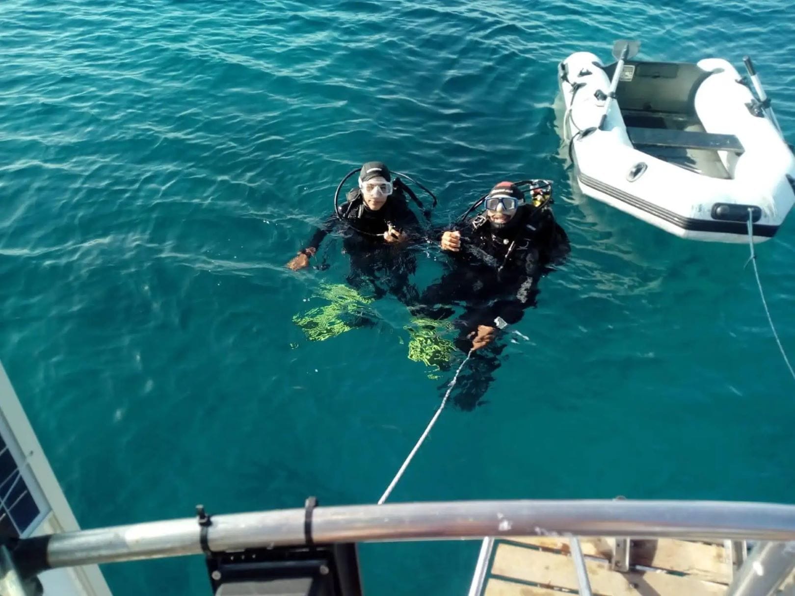 Two people scuba diving in Siracusa waters