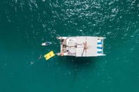 Jump in, float, or paddle as your private catamaran anchors in the crystal-clear waters of Los Cabos—perfect for swimming, relaxing, and ocean fun.